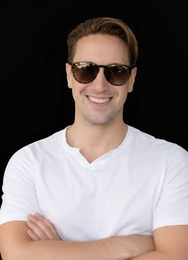 Jason Colapietro wearing sunglasses and a white shirt